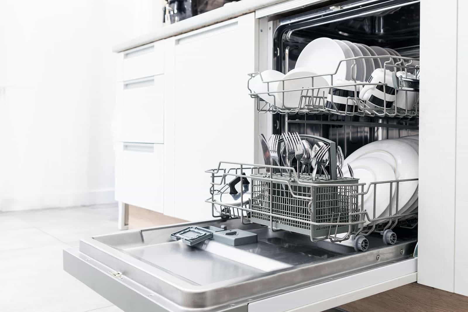 A sparkling clean dishwasher full of dishes