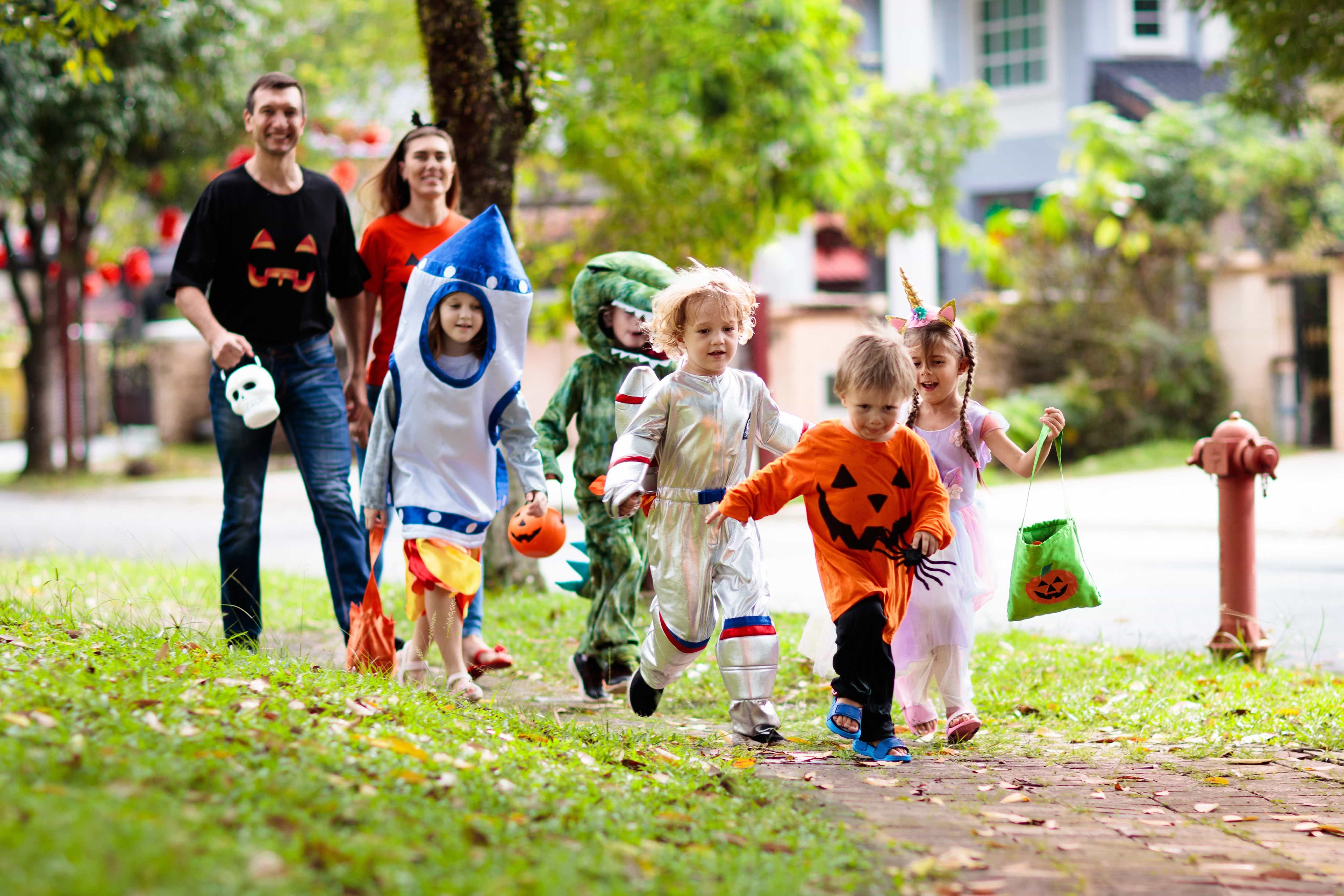 family running trick or treating