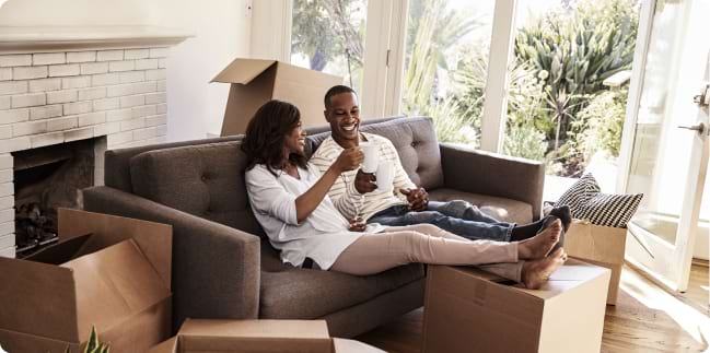 Couple relaxing after moving into new home