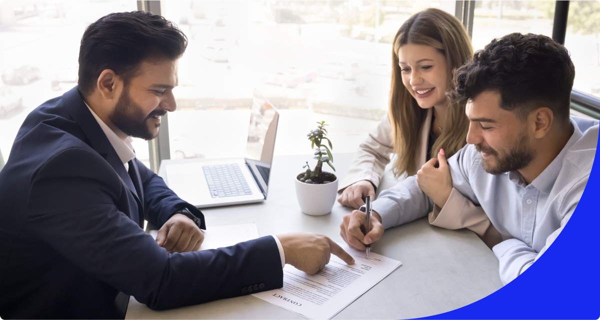 Real estate pro reviewing plan with couple