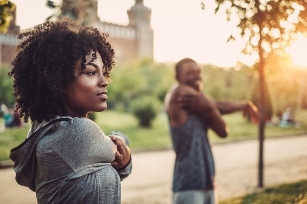 man and woman stretching