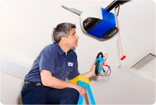 Person fixing garage door opener