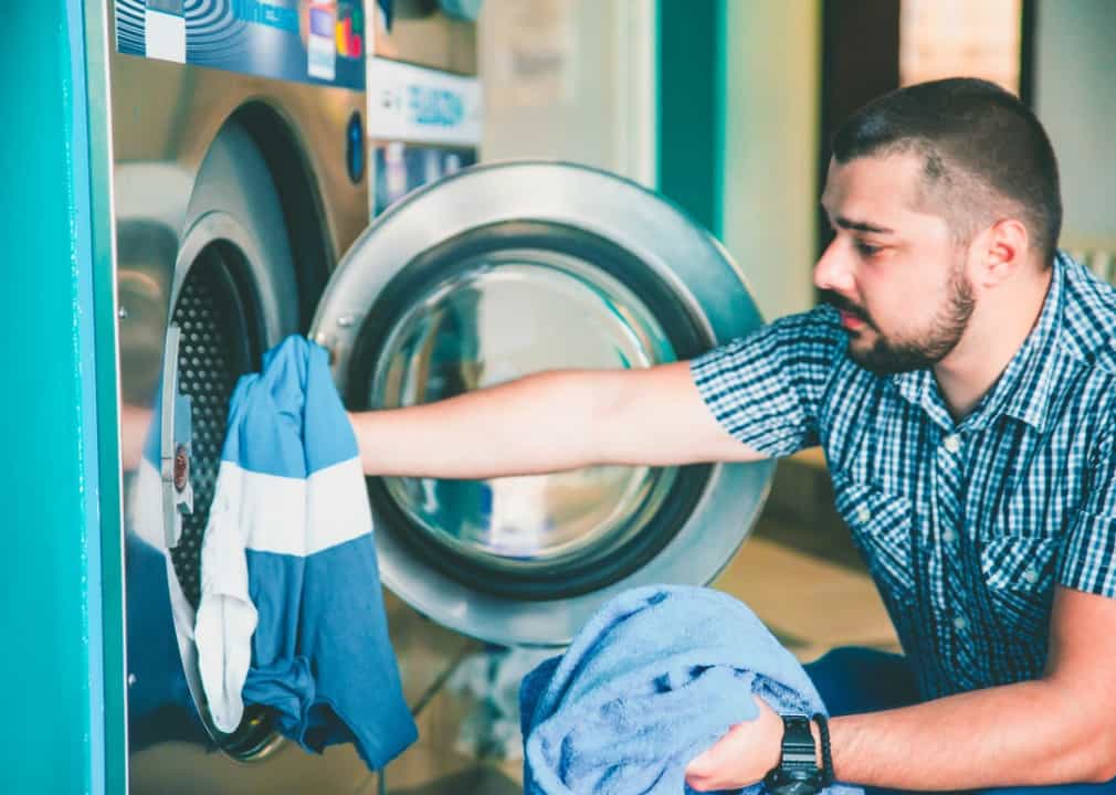 man doing laundry