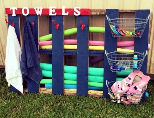 pool noodles in a wooden pallet