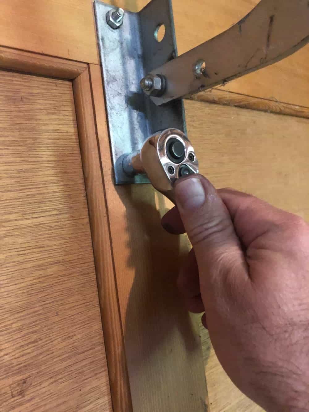 tightening garage door bolt