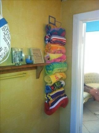 towels on a wall wine rack