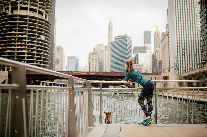 Woman looking out over river in downtown Chicago