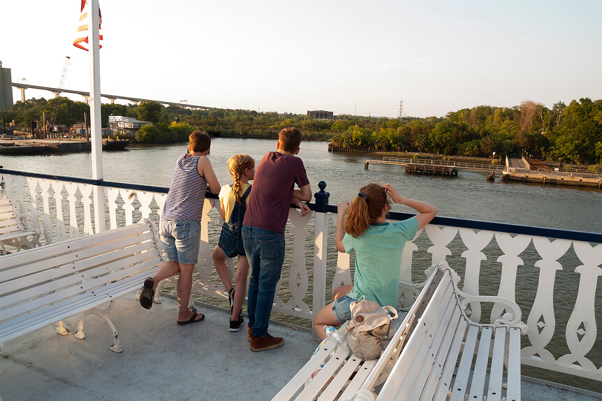 Family on a pier overlooking a lake